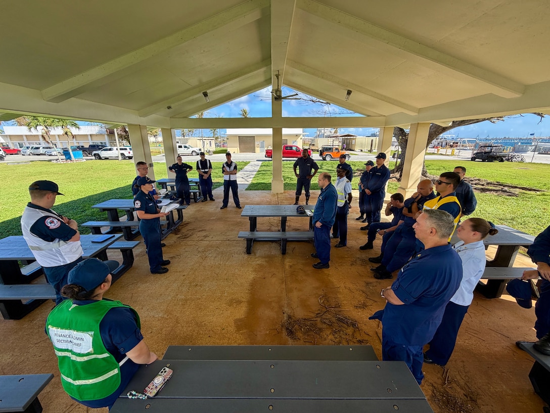 U.S. Coast Guard members of the Super Typhoon Sinlaku incident management team meet in Guam on April 24, 2026, to discuss operations and expectations. U.S. Coast Guard crews pressed north on April 19, 2026, ensuring the safety of Apra Harbor before moving toward communities still isolated by the effects of Super Typhoon Sinlaku, launching a coordinated surge to fully reopen ports across Guam and the Commonwealth of the Northern Mariana Islands and deliver resources. (U.S. Coast Guard photo by Chief Warrant Officer Sara Muir)