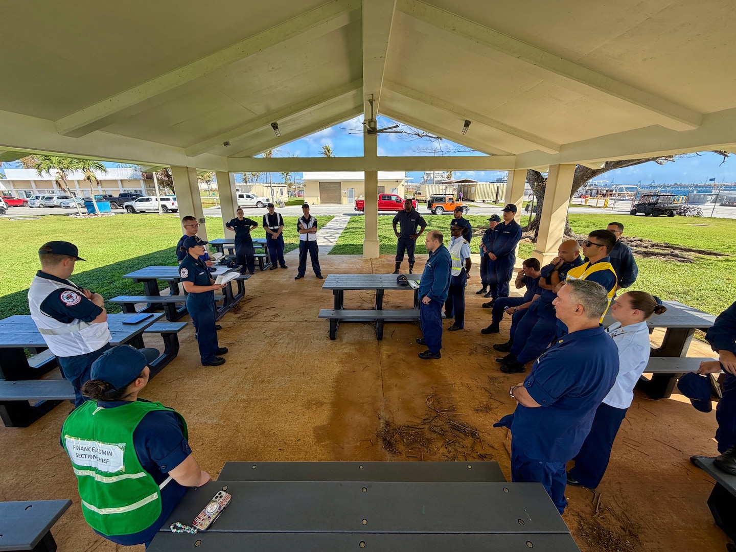 U.S. Coast Guard members of the Super Typhoon Sinlaku incident management team meet in Guam on April 24, 2026, to discuss operations and expectations. U.S. Coast Guard crews pressed north on April 19, 2026, ensuring the safety of Apra Harbor before moving toward communities still isolated by the effects of Super Typhoon Sinlaku, launching a coordinated surge to fully reopen ports across Guam and the Commonwealth of the Northern Mariana Islands and deliver resources. (U.S. Coast Guard photo by Chief Warrant Officer Sara Muir)