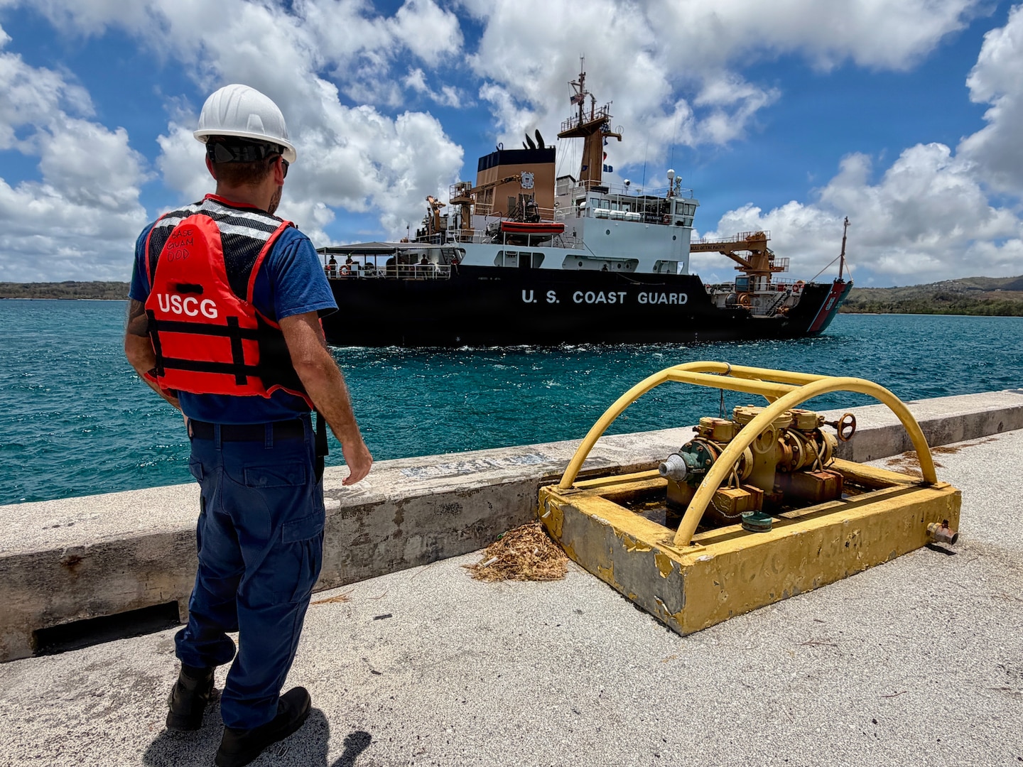 U.S. Coast Guard members aboard USCGC Hickory (WLB 212) return to Guam on April 24, 2026, to resupply and drop off members of the local U.S. Navy Explosive Ordnance Disposal unit after taking relief supplies to Saipan and working aids in Guam and the Commonwealth of the Northern Mariana Islands. U.S. Coast Guard crews pressed north on April 19, 2026, ensuring the safety of Apra Harbor before moving toward communities still isolated by the effects of Super Typhoon Sinlaku, launching a coordinated surge to fully reopen ports across Guam and the Commonwealth of the Northern Mariana Islands and deliver resources. (U.S. Coast Guard photo by Chief Warrant Officer Sara Muir)