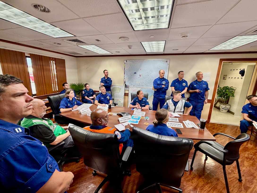 U.S. Coast Guard members of the Super Typhoon Sinlaku incident management team meet in Guam on April 27, 2026, to discuss updated objectives as they enter a new phase of the response focused on environmental recovery and marine safety. U.S. Coast Guard crews pressed north on April 19, 2026, ensuring the safety of Apra Harbor before moving toward communities still isolated by the effects of Super Typhoon Sinlaku, launching a coordinated surge to fully reopen ports across Guam and the Commonwealth of the Northern Mariana Islands and deliver resources. (U.S. Coast Guard photo by Chief Warrant Officer Sara Muir)
