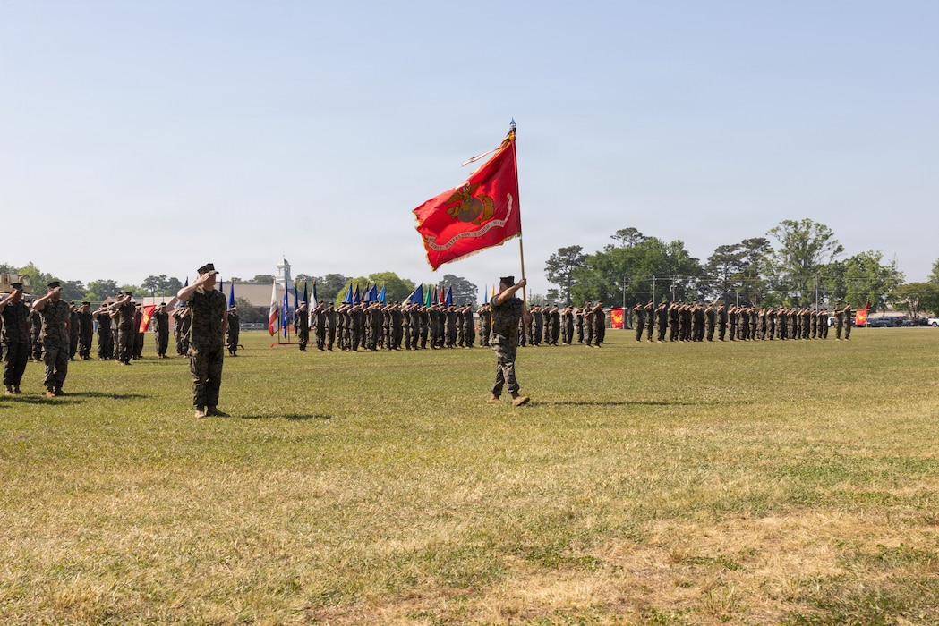U.S. Marine Corps Sgt. Maj. Gilbert Gillis, senior enlisted advisor with 1st Battalion, 8th Marines, 6th Marine Regiment, 2nd Marine Division, marches with the colors during a change of command ceremony on Camp Lejeune, North Carolina, April 23, 2026. During the ceremony, Lt. Col. Joseph Fontanetta relinquished command to Lt. Col. Matthew Tweedy, symbolizing the transfer of authority, responsibility and accountability of the Marines under his charge. (U.S. Marine Corps photo by Cpl. Jesse Davis)