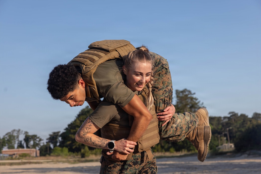 U.S. Marine Corps Lance Cpl. Issac LlanezDelgado, left, a combat videographer and Lance Cpl. Sabine Wilson, a combat photographer both with II Marine Expeditionary Force Support Battalion participate in the culminating event of a Lance Corporal Leadership and Ethics Seminar at Camp Lejeune, North Carolina, April 23, 2026. The seminar enhances junior Marine’s leadership skills while promoting a better understanding of Marine Corps values. (U.S. Marine Corps photo by Lance Cpl. Ethan Claassen)