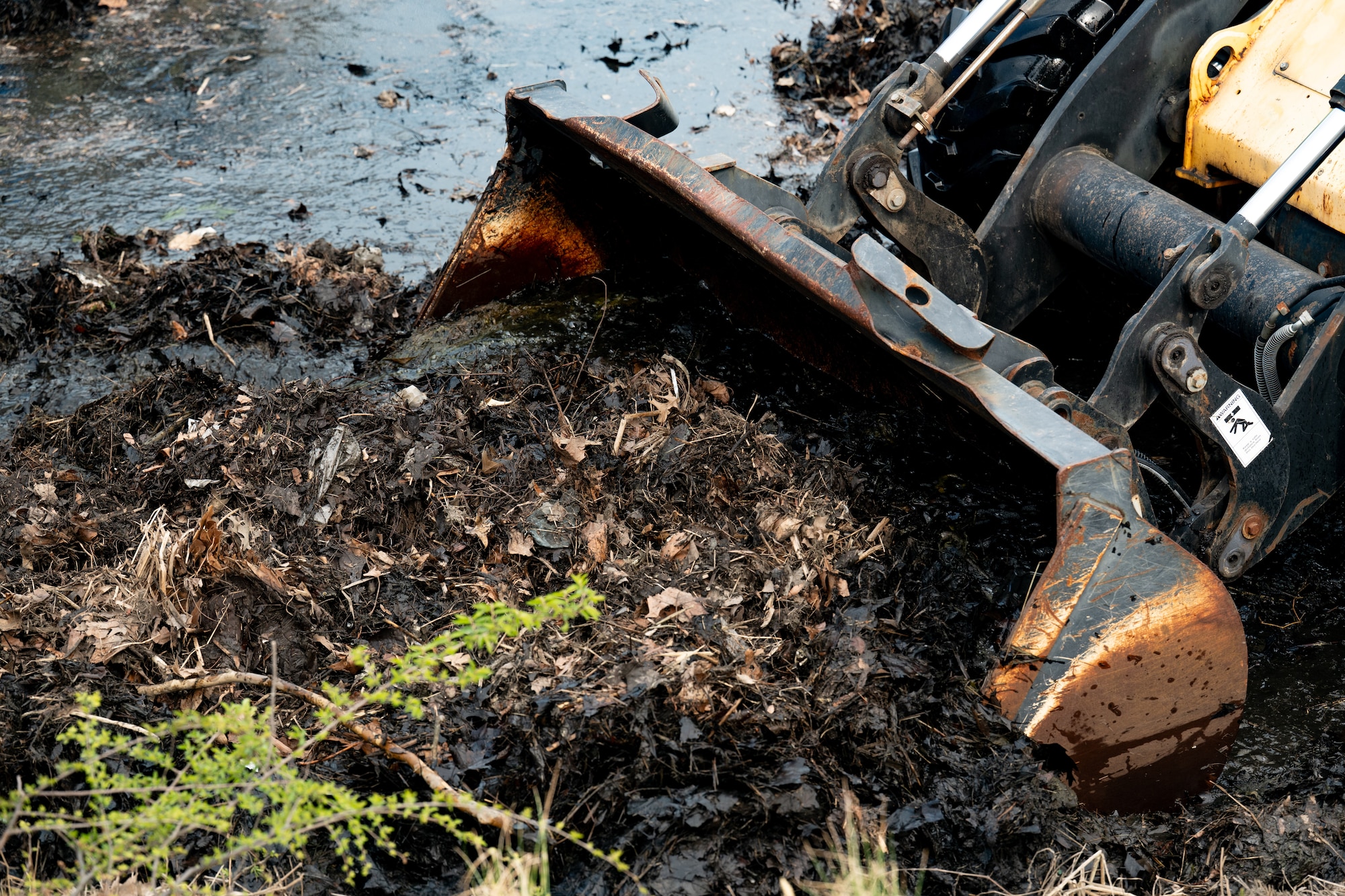 Airmen removed buildup from a drainage outfall to keep water moving and reduce pollution. Small actions like these play a direct role in protecting the environment and supporting the surrounding community.