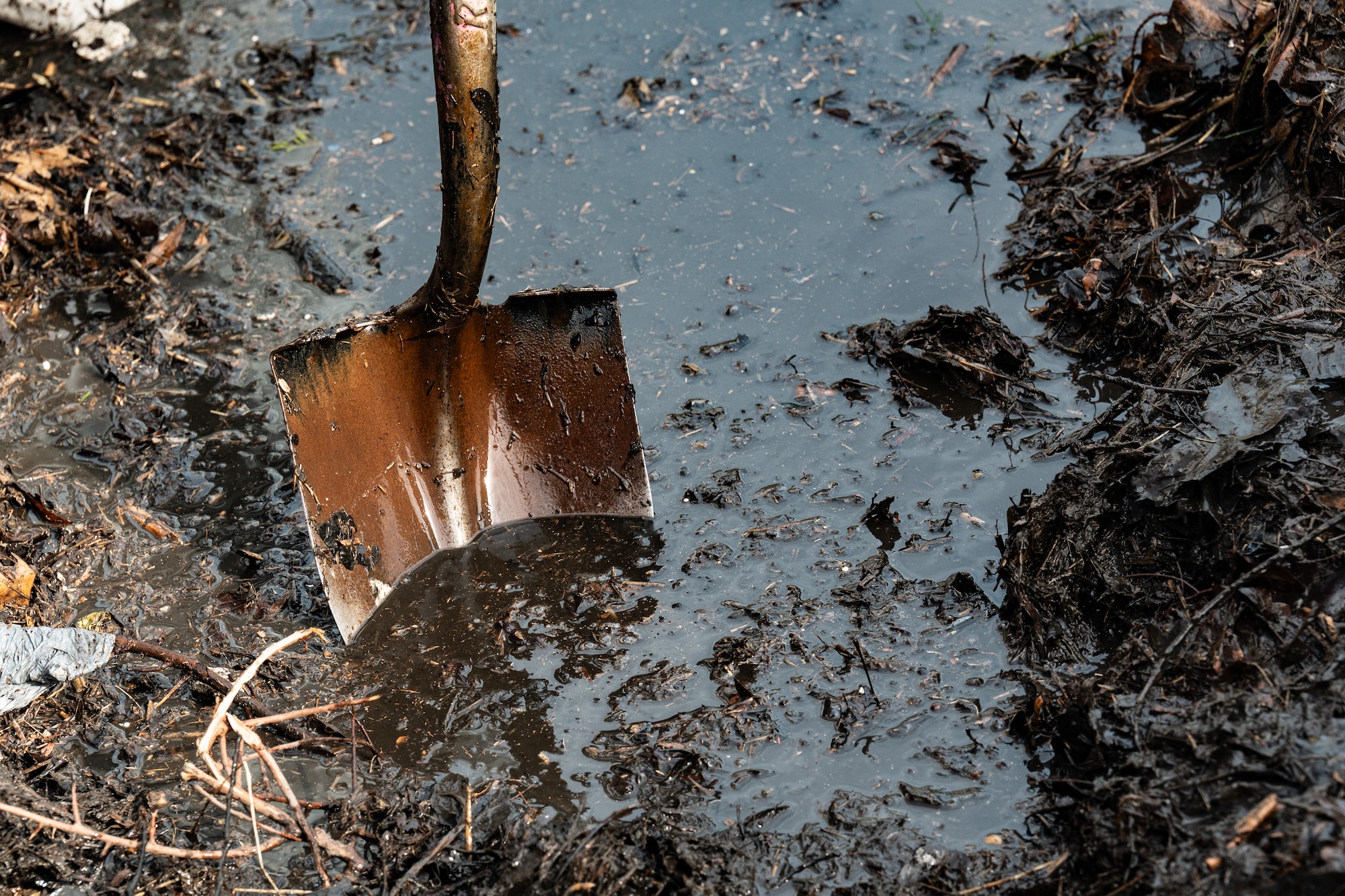 Airmen removed buildup from a drainage outfall to keep water moving and reduce pollution. Small actions like these play a direct role in protecting the environment and supporting the surrounding community.