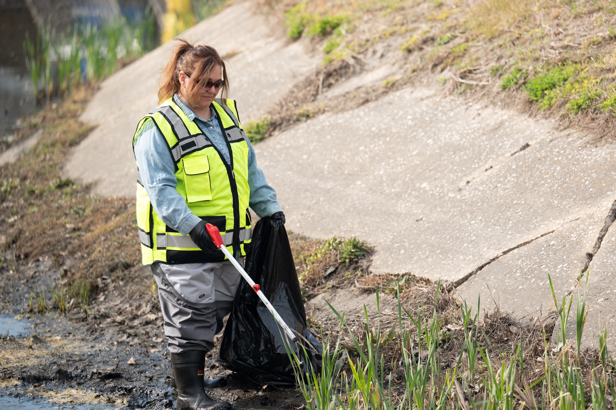 Airmen removed buildup from a drainage outfall to keep water moving and reduce pollution. Small actions like these play a direct role in protecting the environment and supporting the surrounding community.
