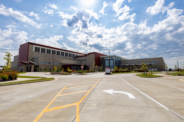 An image of a large building on a bright blue sky.