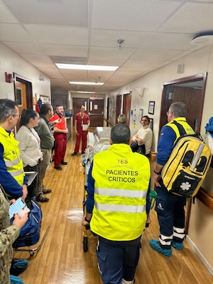 260211-N-FT324-1086. ROTA, SPAIN (February 12, 2026)— U.S. Naval Hospital (USNH) Rota staff and Spanish 061 emergency medical personnel conduct a team debrief following a neonatal emergency transport drill at Naval Station Rota. The debrief provided an opportunity to review coordination, communication, and response procedures, reinforcing interoperability with host nation partners and strengthening warfighter readiness through enhanced emergency response capabilities. (U.S. Navy photo by Lt. Cmdr. Alicia Sacks)