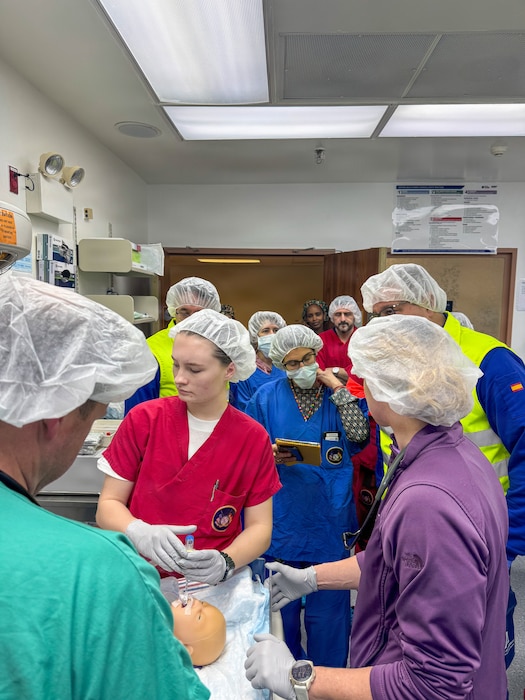 260212-N-FT324-4663. ROTA, SPAIN (February 12, 2026)— U.S. Naval Hospital Rota neonatal response team members participate in a simulated neonatal emergency alongside Spanish 061 emergency medical services personnel in the operating room at Naval Station Rota. The exercise focused on rapid assessment, stabilization, and coordinated transport of a newborn patient, strengthening interoperability with host nation partners and supporting warfighter readiness by ensuring timely, high-quality care for service members and their families. (U.S. Navy photo by Lt. Cmdr. Alicia Sacks)