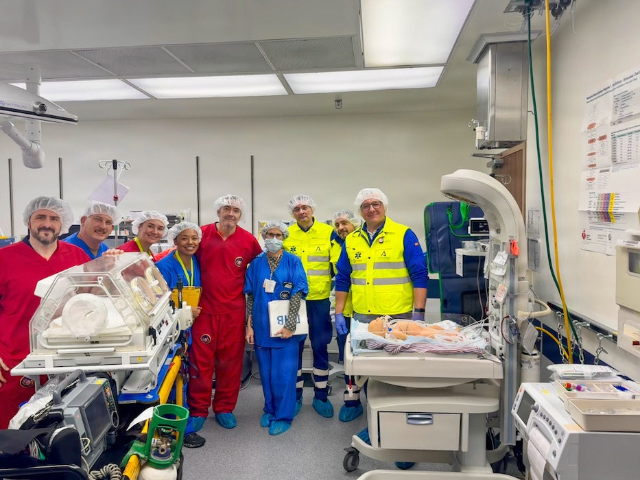260212-N-FT324-8538. ROTA, SPAIN (February 12, 2026)— U.S. Naval Hospital Rota clinical staff and Spanish 061 emergency medical services personnel stand together for a group photo following a simulated neonatal emergency in the operating room at Naval Station Rota. The joint exercise strengthened coordination and interoperability between U.S. and host-nation medical teams while reinforcing warfighter readiness through rapid response and patient transport capabilities. (U.S. Navy photo by Lt. Cmdr. Alicia Sacks)
