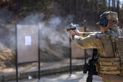 U.S. Air Force Airman 1st Class Holden P. Cooke, 145th Security Forces Squadron defender, fires a M18 pistol after transitioning from the M4A1 carbine during the Warrior Skills Course, Albemarle Police Department firing range, Albemarle, N.C., March 9, 2026.