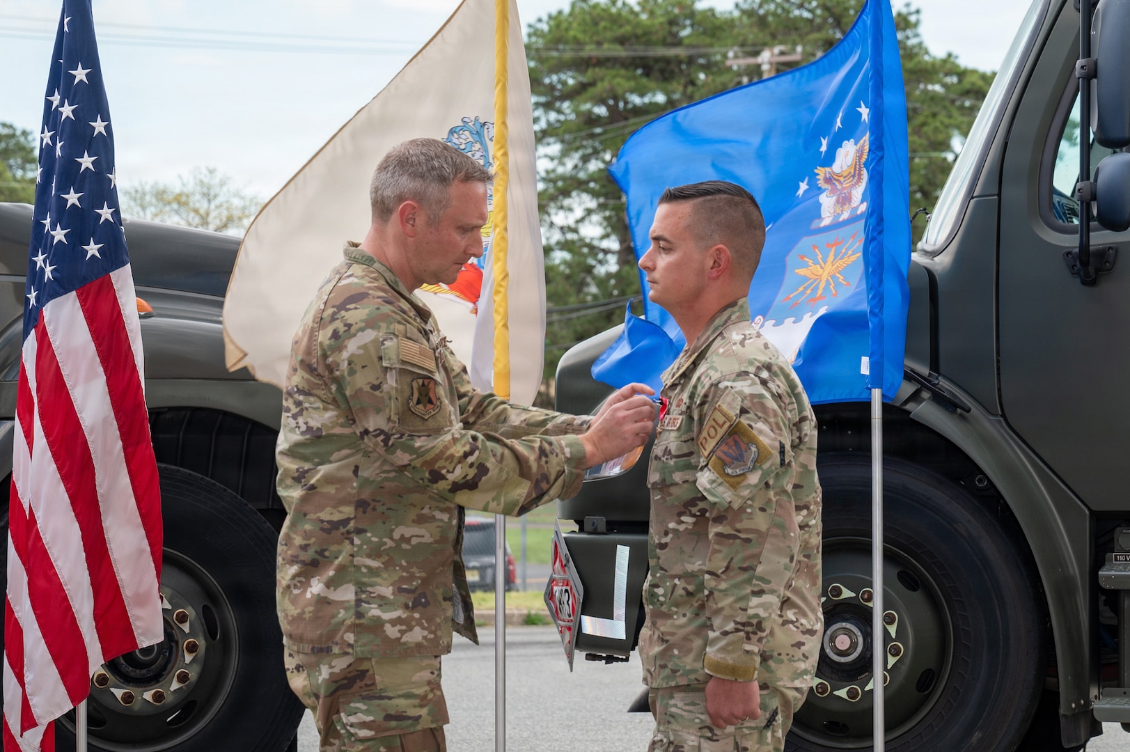U.S. Air Force Master Sgt. Charles Zingrone, 177th Fighter Wing Logistics Readiness Squadron Petroleum, Oils and Lubricants fuels management flight chief, receives a Bronze Star medal from Col. Matthew Vanderschuere, 177th Fighter Wing Mission Support Group commander, during a presentation ceremony for Zingrone at the 177th Petroleum, Oils and Lubricants facility, Egg Harbor Township, New Jersey, April 17, 2026.