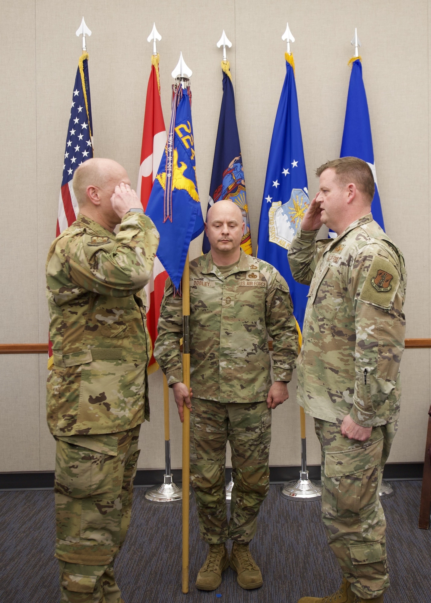 Col. Joseph J. Miller, Jr., right, takes the 224th Air Defense Group guidon from Maj. Gen. Charlton, the New York Air National Guard commander, during an assumption of command ceremony on April 23 at the Eastern Air Defense Sector in Rome. The guidon exchange serves as the ceremony’s centerpiece and symbolizes the passing of command to a new commander. Chief Master Sgt. Geoffrey Dooley, the 224th ADS Senior Enlisted Leader, was the guidon bearer and is pictured in the center.