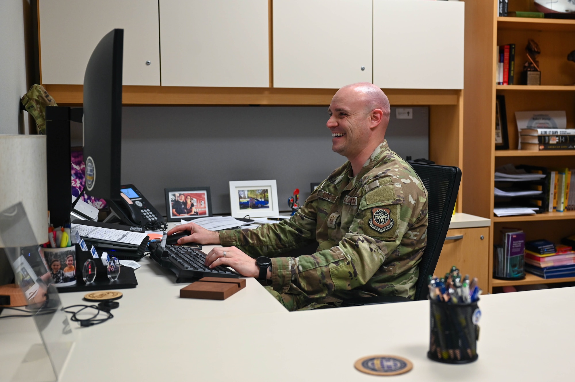 Man types on a computer.