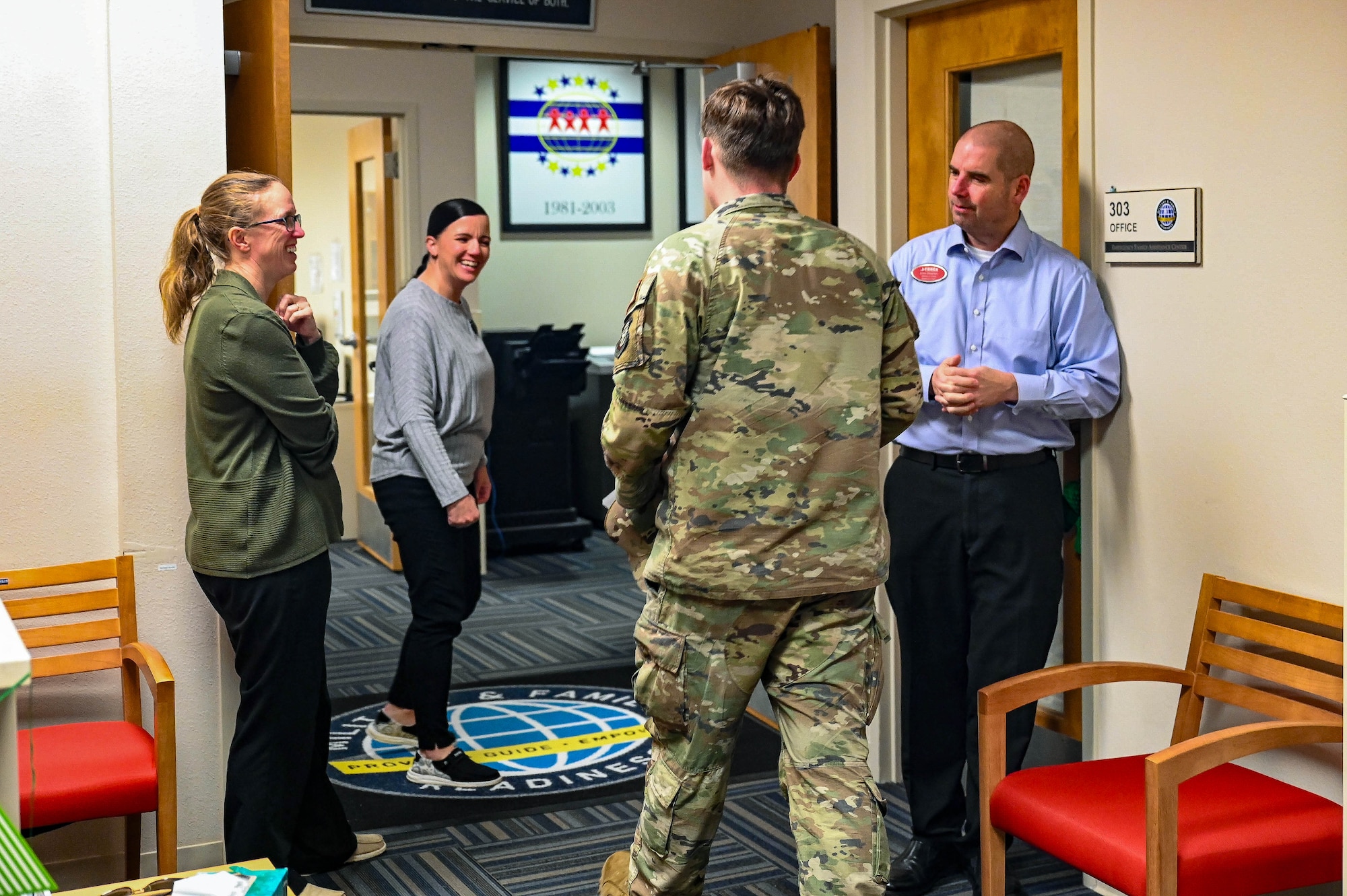 Military member walks into MFRC office and is greeted by staff.