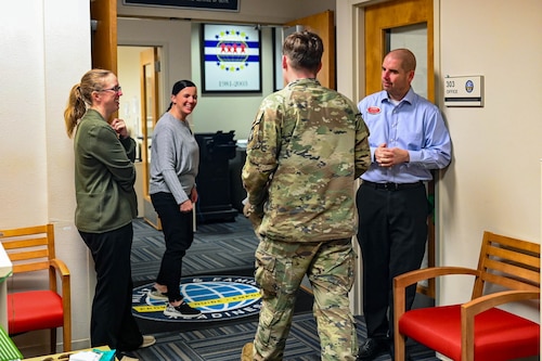 Military member walks into MFRC office and is greeted by staff.
