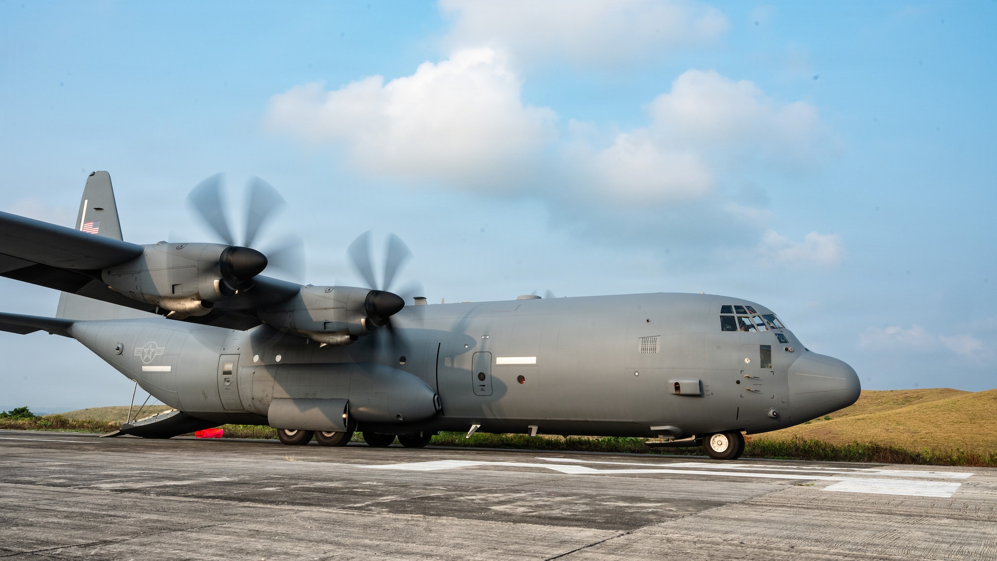 Airmen and Soldiers load a High Mobility Artillery Rocket System into a C-130 cargo plane