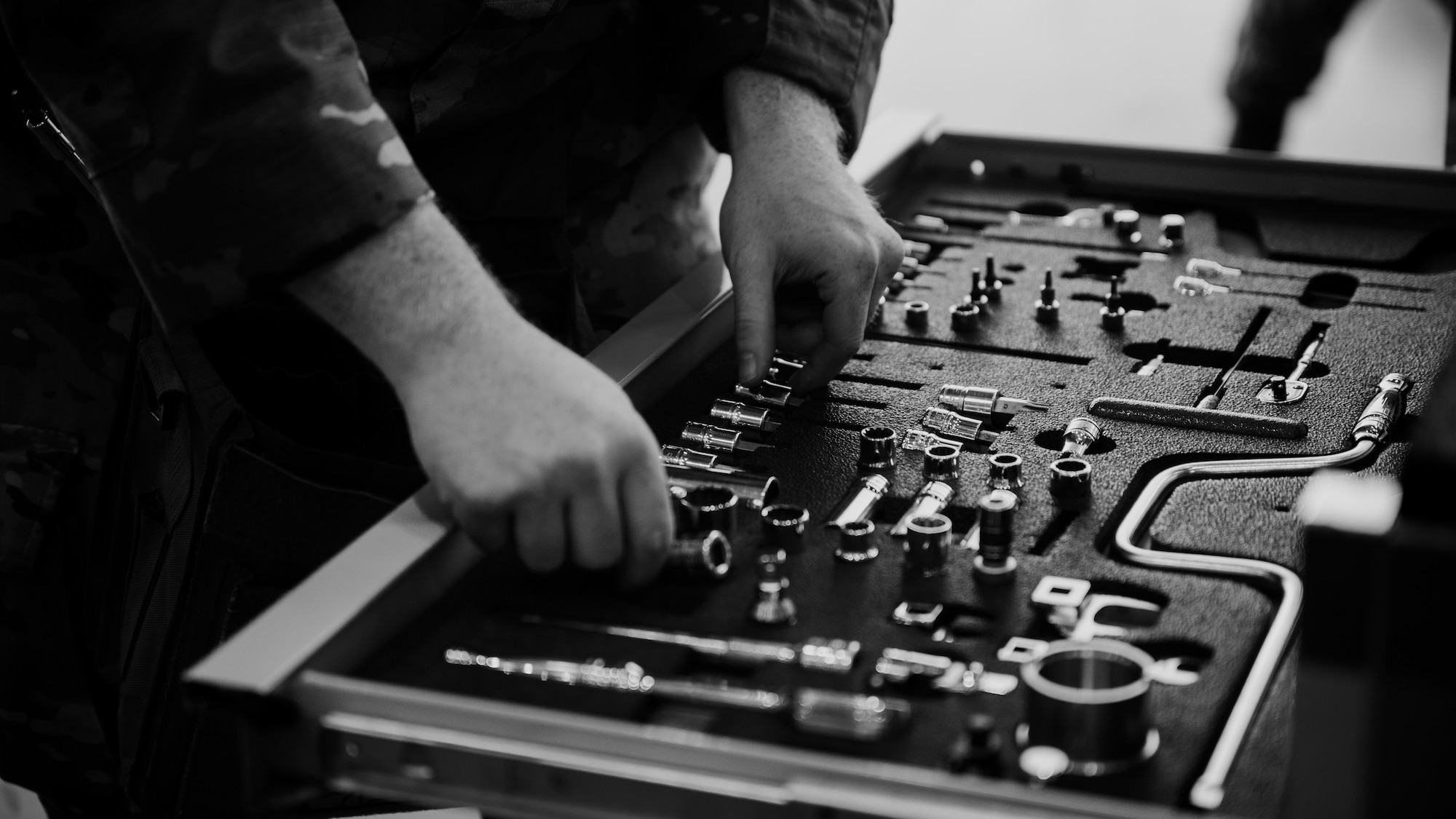 A U.S. Air Force Airman changes out tools