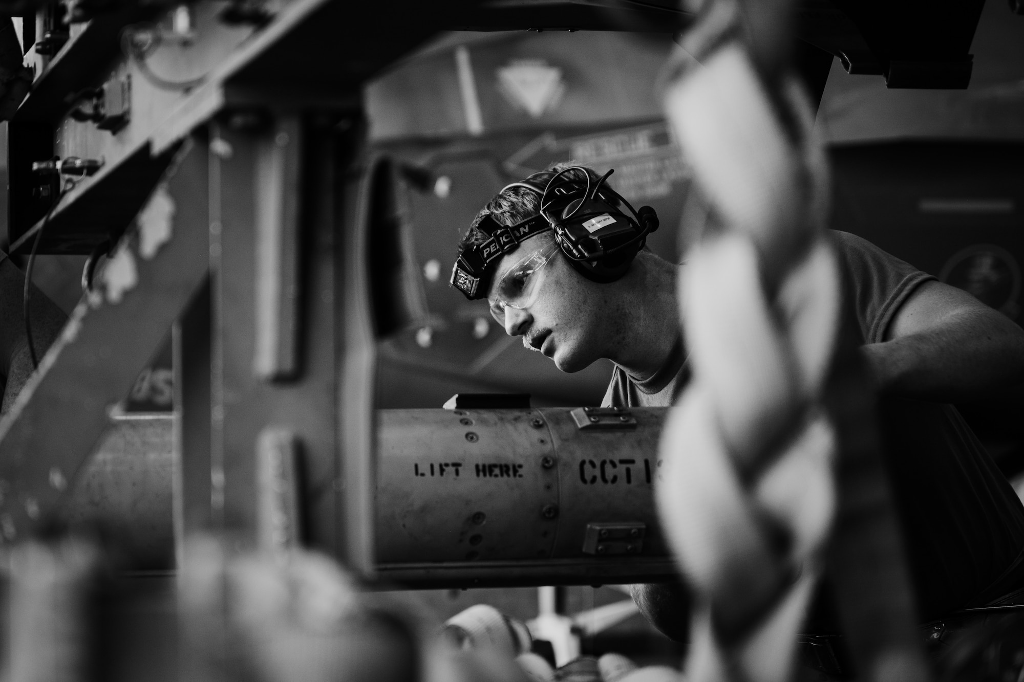 U.S. Air Force Staff Sgt. Austin Murray, 62nd Aircraft Maintenance Unit weapons load team member, examines training ordnance during the 56th Fighter Wing’s first quarter weapons load competition.