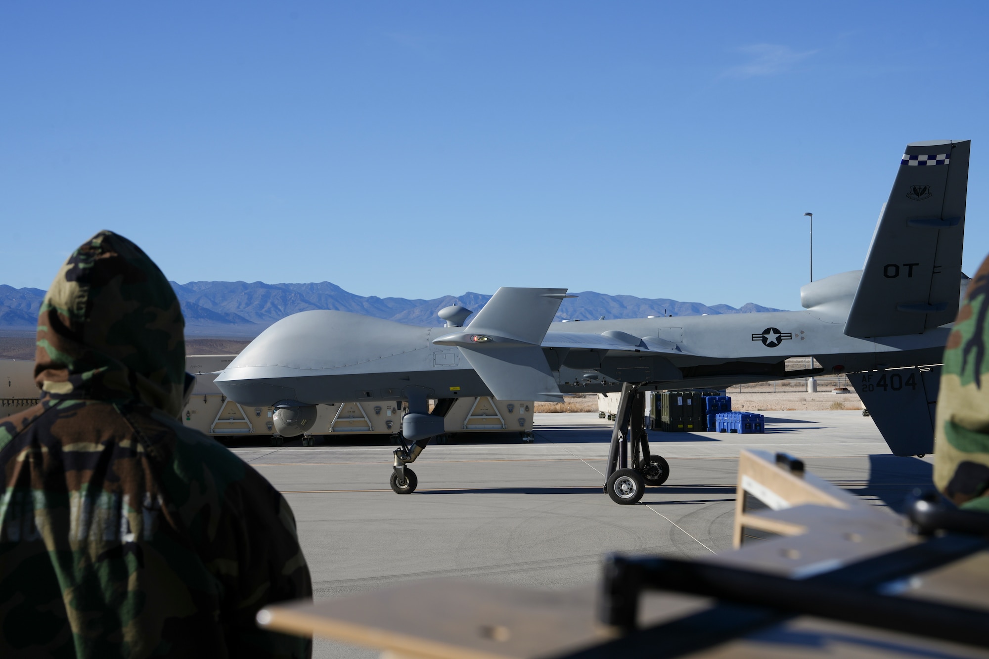 U.S. Airman assigned to the 25th Aircraft Maintenance Squadron observes an MQ-9 Reaper taxi after performing preflight operations during a training exercise at Creech Air Force Base, Nevada, Jan. 14, 2026.