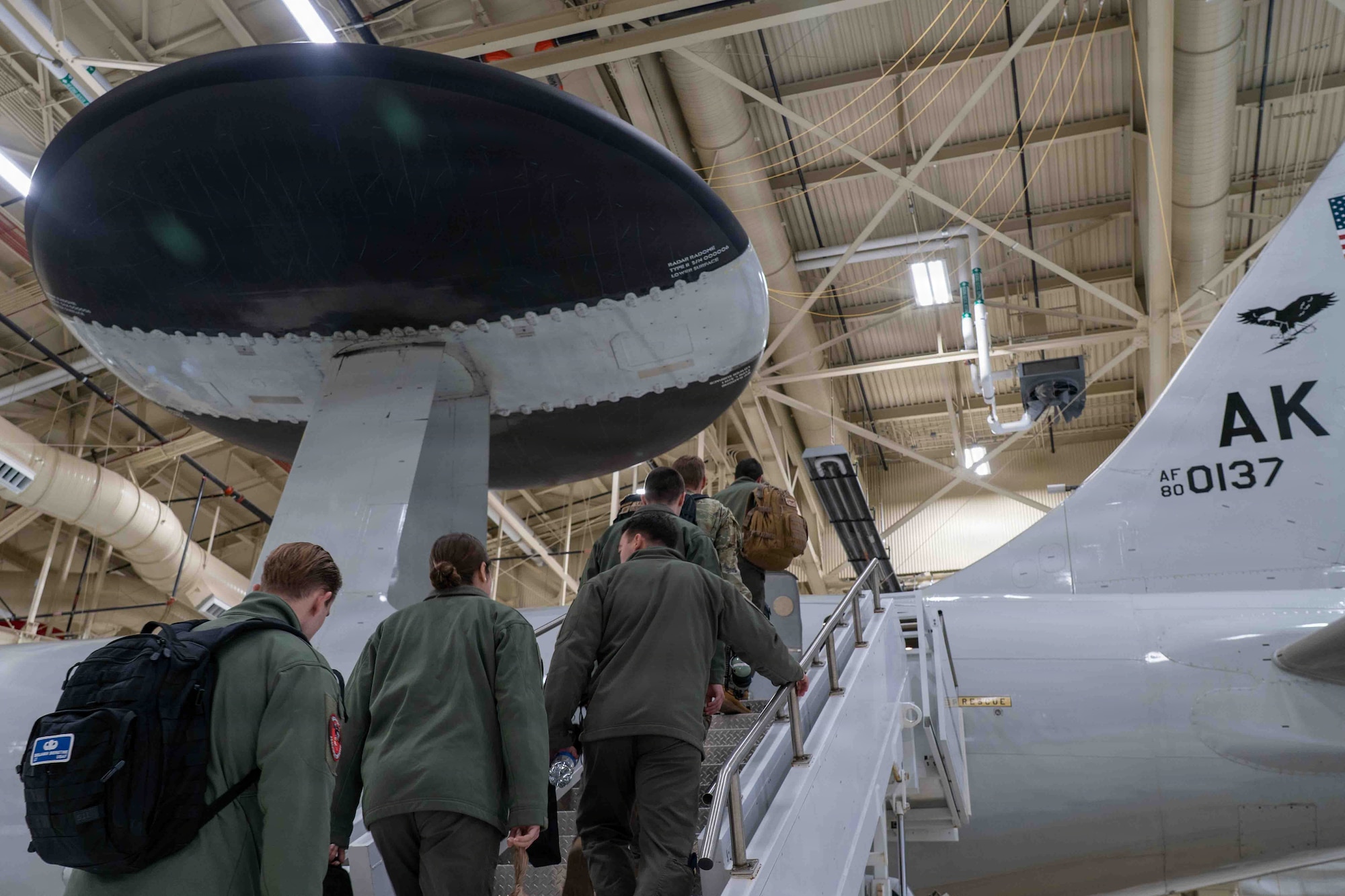 U.S. Air Force Airmen assigned to the 961st Airborne Air Control Squadron board an E-3 Sentry assigned to the 962nd AACS during Red Flag 26-1 at Joint Base Elmendorf-Richardson, Alaska, April 23, 2026.