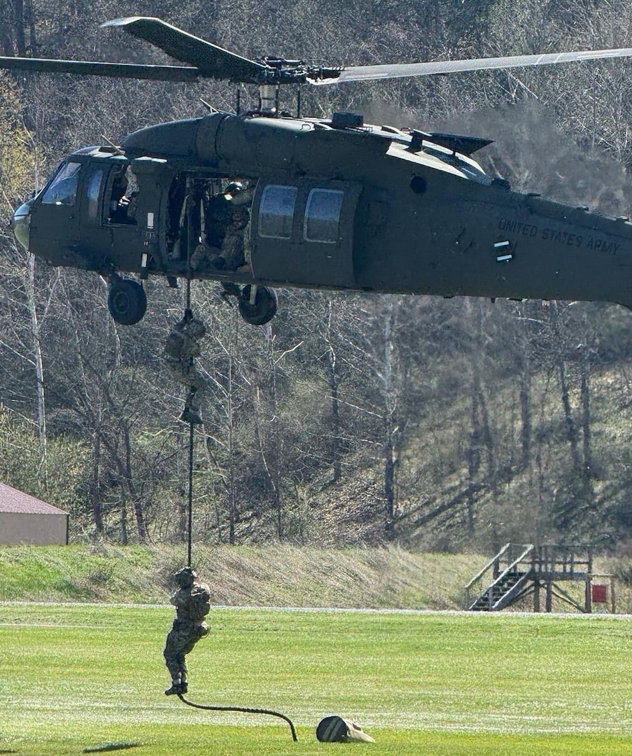 men in combination of civilian and military uniforms performing day and night maneuvers in a variety of urban and forest environment