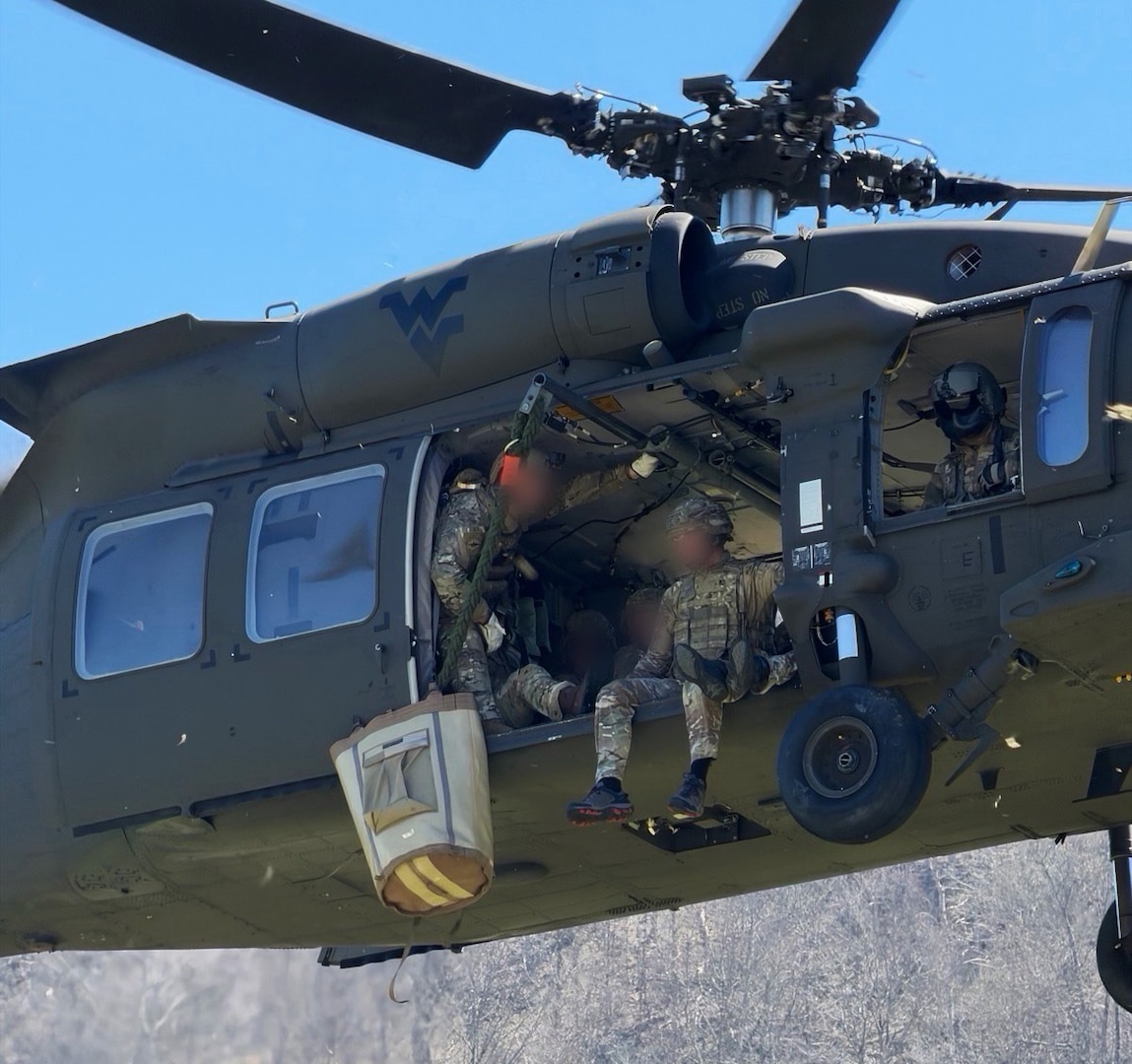 men in combination of civilian and military uniforms performing day and night maneuvers in a variety of urban and forest environment