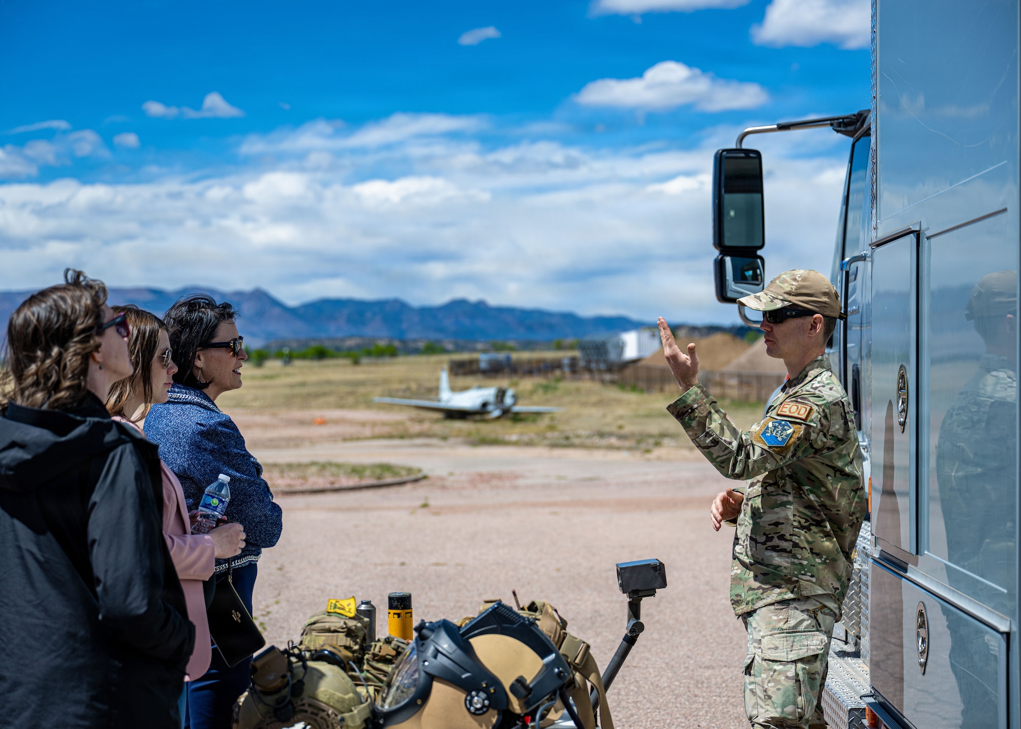 An EOD technician speaks to a tour group.