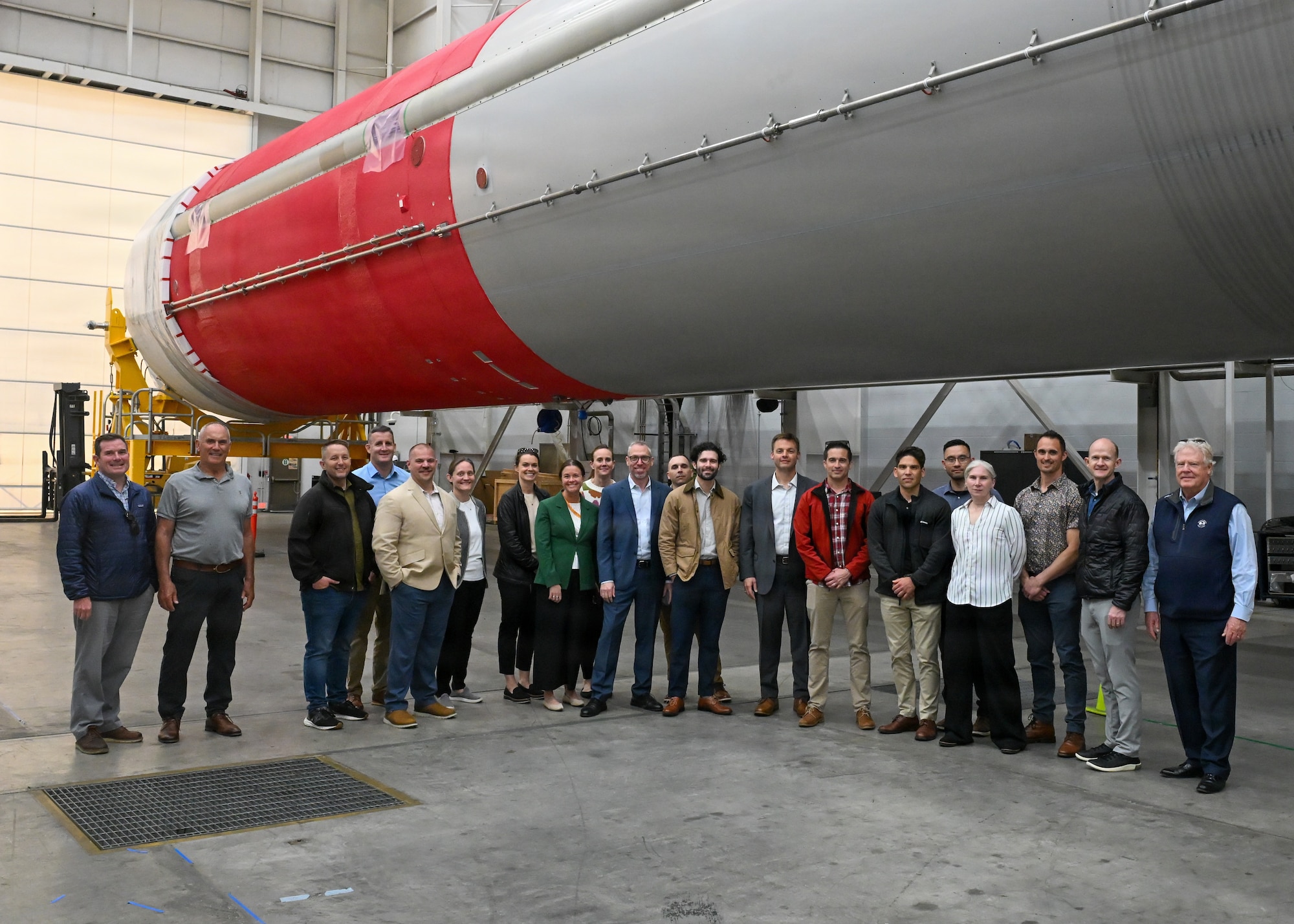 People stand together and pose for a group photo