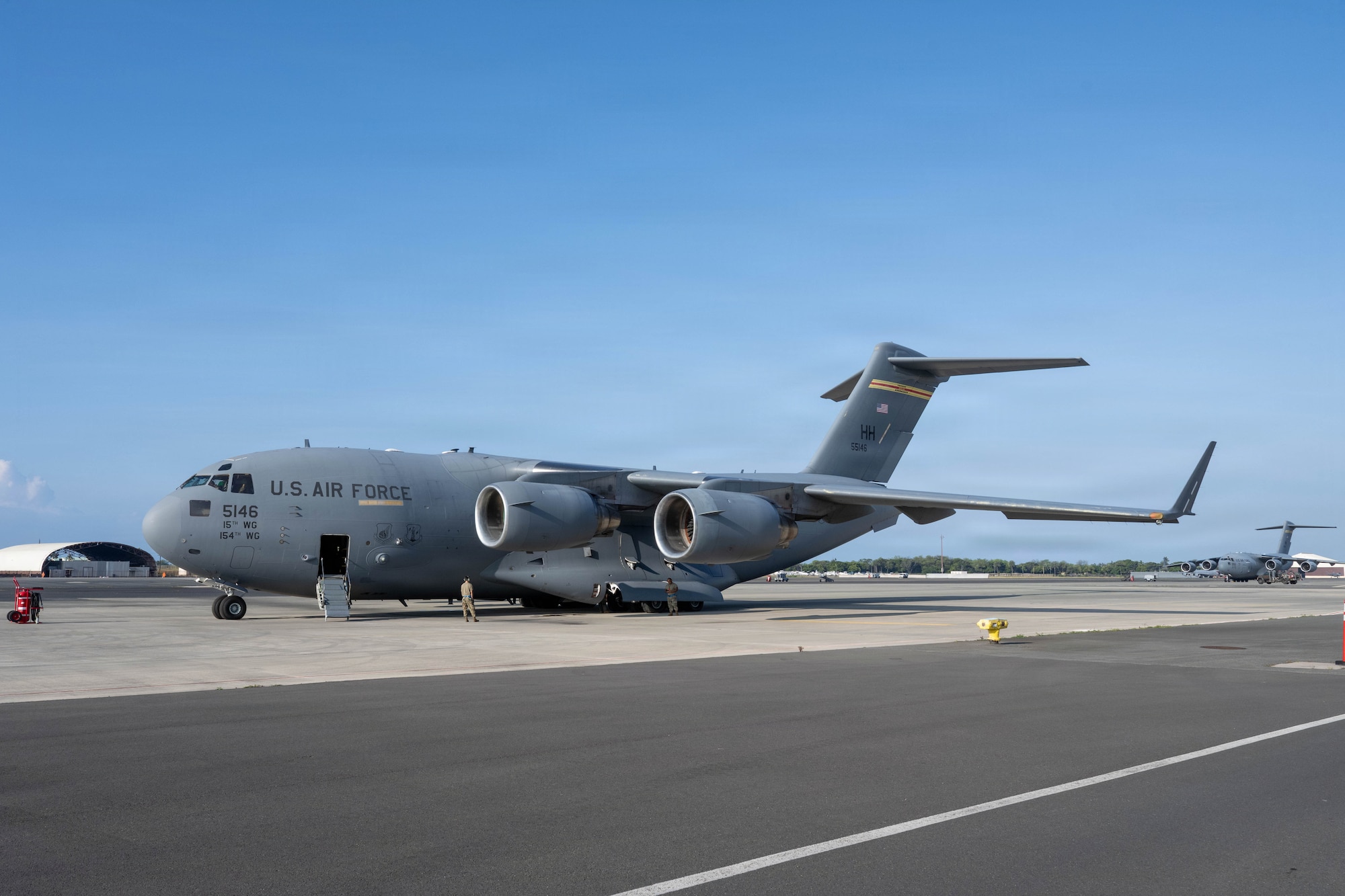 A C-17 Globemaster III aircraft sits on the flight line at Joint Base Pearl Harbor-Hickam, Hawaii.