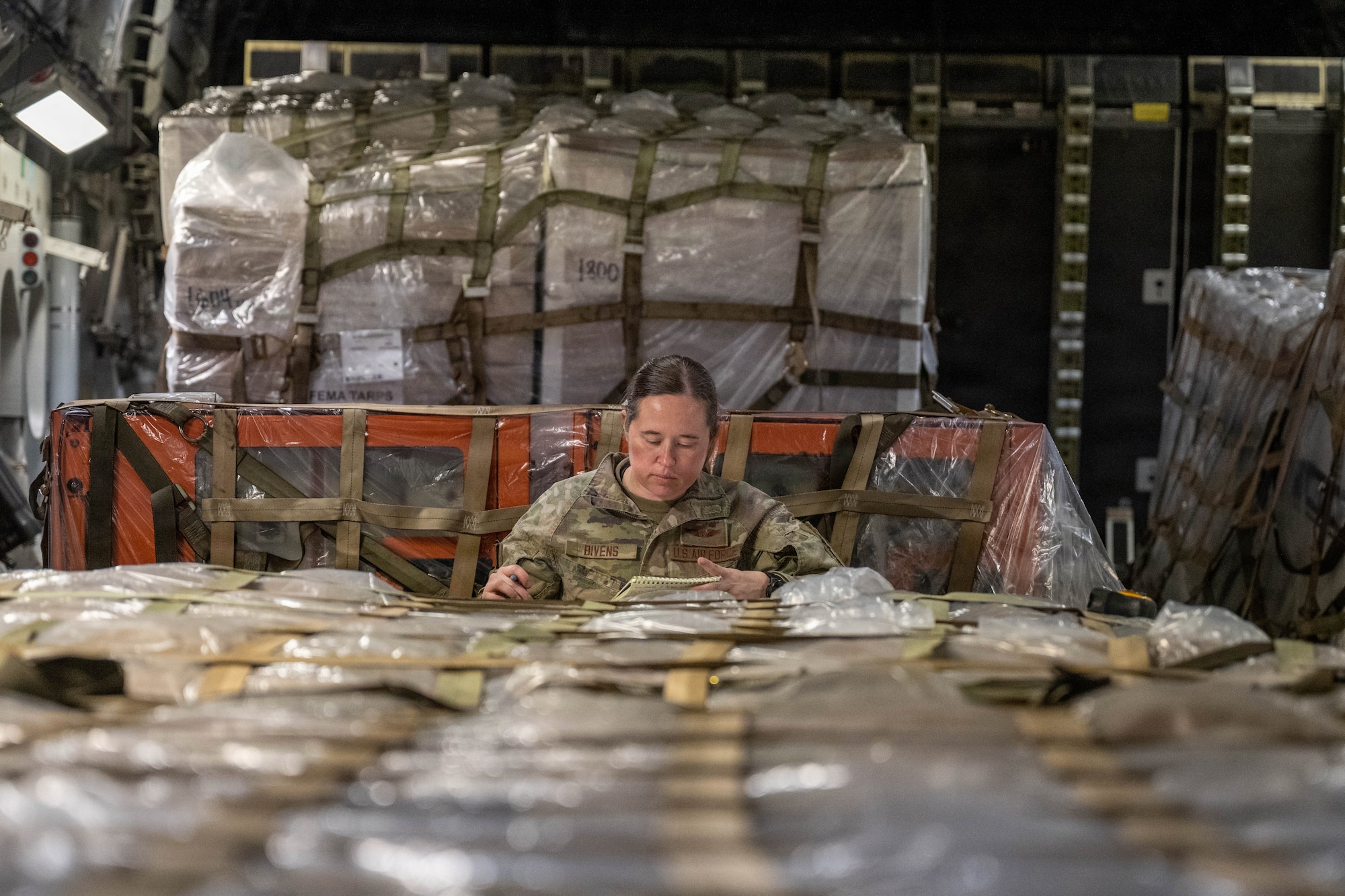 U.S. Air Force Staff Sgt Jamie Blevins, 535th Airlift Squadron noncommissioned officer in charge, performs final checks in a C-17 Globemaster III.