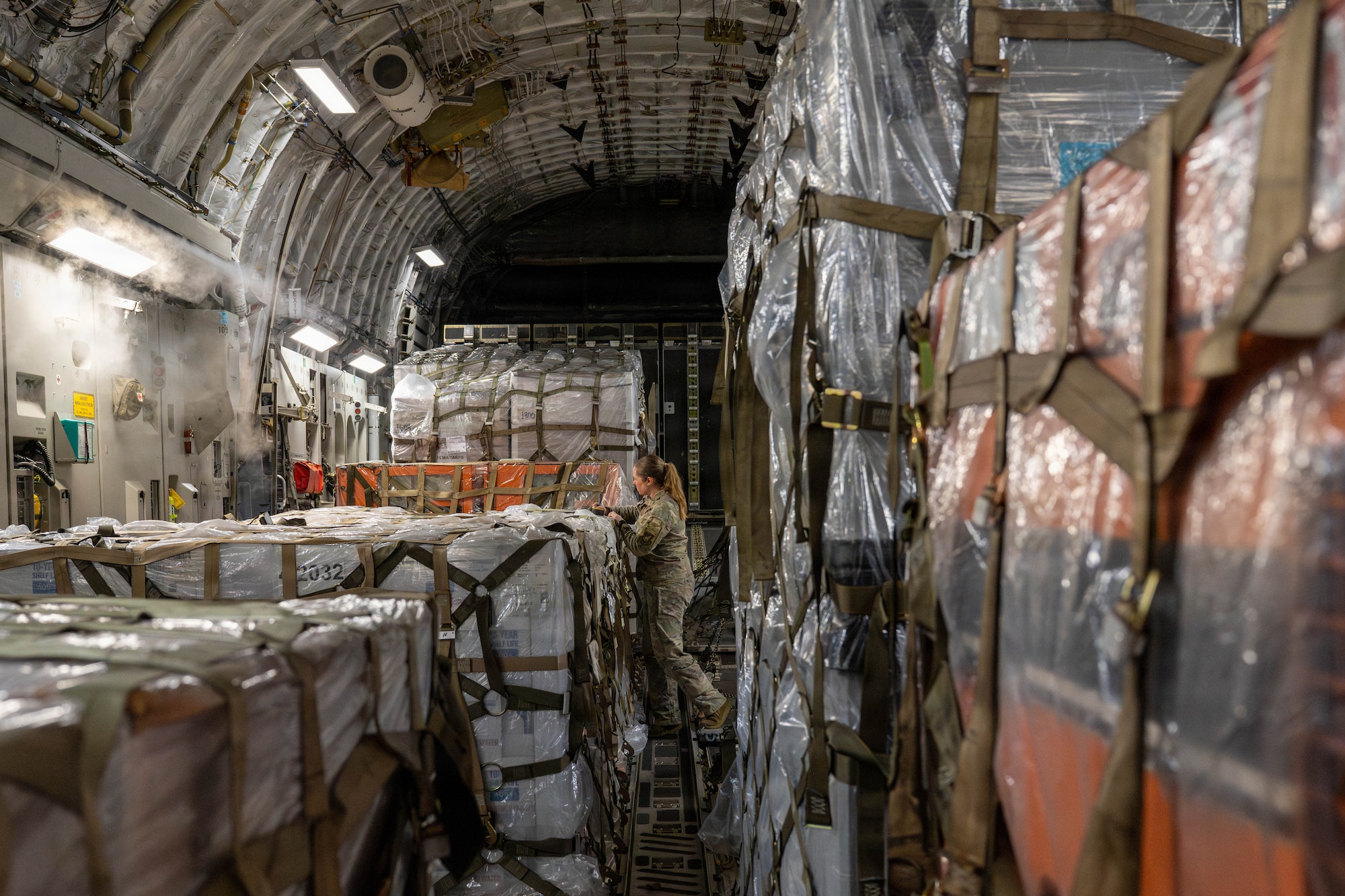 U.S. Air Force Staff Sgt Jamie Blevins, 535th Airlift Squadron noncommissioned officer in charge, performs final checks in a C-17 Globemaster III.