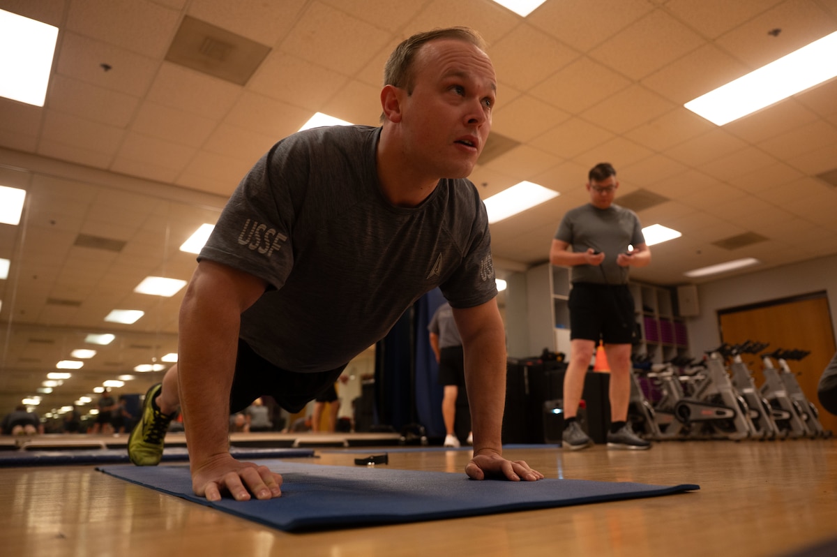 U.S. Space Force Maj. Michael “Doc” Quinn, Space Forces Southern deputy director of plans, strategy and engagements, performs a pushup during a Human Performance Assessment at Davis-Monthan Air Force Base, Arizona, April 23, 2026. The HPA is the Space Force’s equivalent to the U.S. Air Force Fitness Assessment. (U.S. Air Force photo by Airman 1st Class Jaden Kidd)