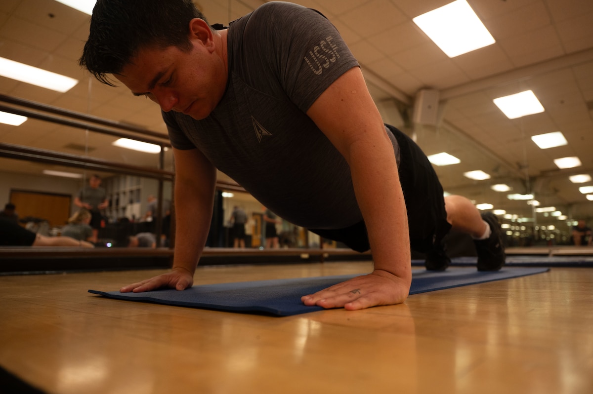U.S. Space Force Maj. Kevin “A-Ten” Aneshansley, Space Forces Southern director of training and exercises, performs a pushup during a Human Performance Assessment at Davis-Monthan Air Force Base, Arizona, April 23, 2026. The HPA requires Guardians to complete a push-up component, a sit-up component, and a 2-mile run. (U.S. Air Force photo by Airman 1st Class Jaden Kidd)