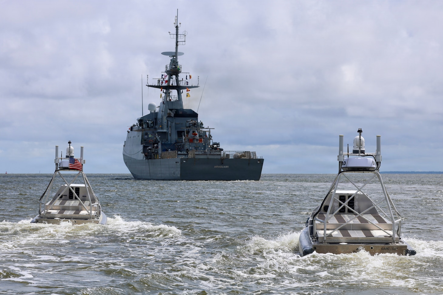Global Autonomous Reconnaissance Crafts (GARC) deploy in formation with the Brazilian Amazonas-class offshore patrol vessel Araguari (P122) during a live robotic and autonomous systems (RAS) demonstration with Commander, Task Force (CTF) 66 during Exercise Obangame Express 2026 in Douala, Cameroon, April 25, 2026.