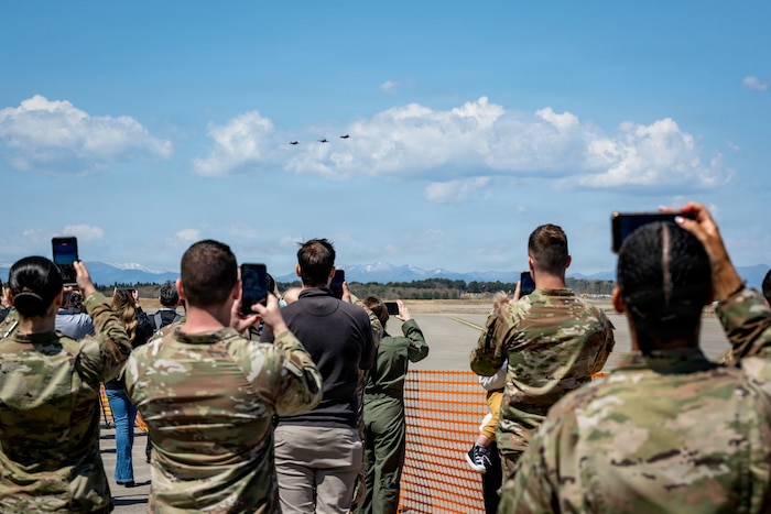U.S. Airmen assigned to the 35th Fighter Wing (FW) take photos during a flyover performed by U.S. Air Force F-35 Lighting IIs and an F-16 Fighting Falcon at Misawa Air Base, Japan, April 24, 2026. The flyover marked a key milestone in the wing’s transition to fifth-generation airpower, demonstrating the integration of legacy and next-generation capabilities. This transition enhances the 35th FW’s ability to generate combat airpower and reinforces deterrence within the Indo-Pacific area of operation. (U.S. Air Force photo by Senior Airman Andre Medina)