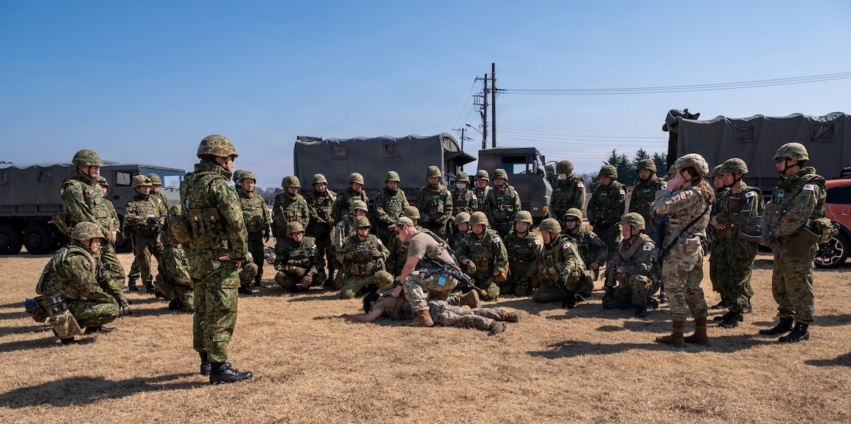 Defenders assigned to the 374th Security Forces Squadron demonstrate security procedures to Japan Ground Self-Defense Force members.
