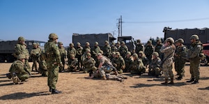 Defenders assigned to the 374th Security Forces Squadron demonstrate security procedures to Japan Ground Self-Defense Force members.