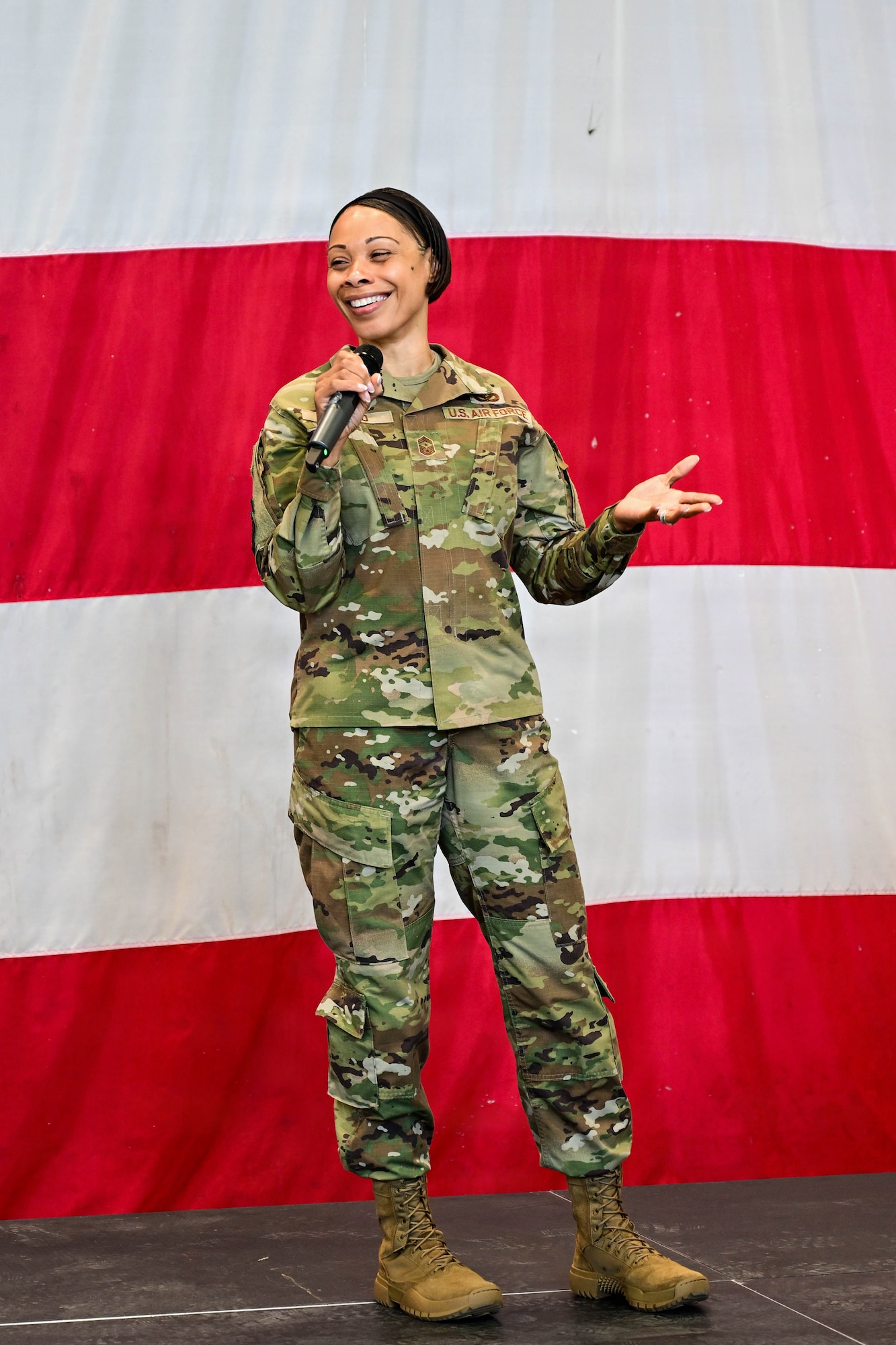 U.S. Air Force Chief Master Sgt. Tiffany Griego, 31st Fighter Wing command chief, gives closing remarks during the 31st FW 1st Quarter Awards ceremony at Aviano Air Base, Italy, April 24, 2026.