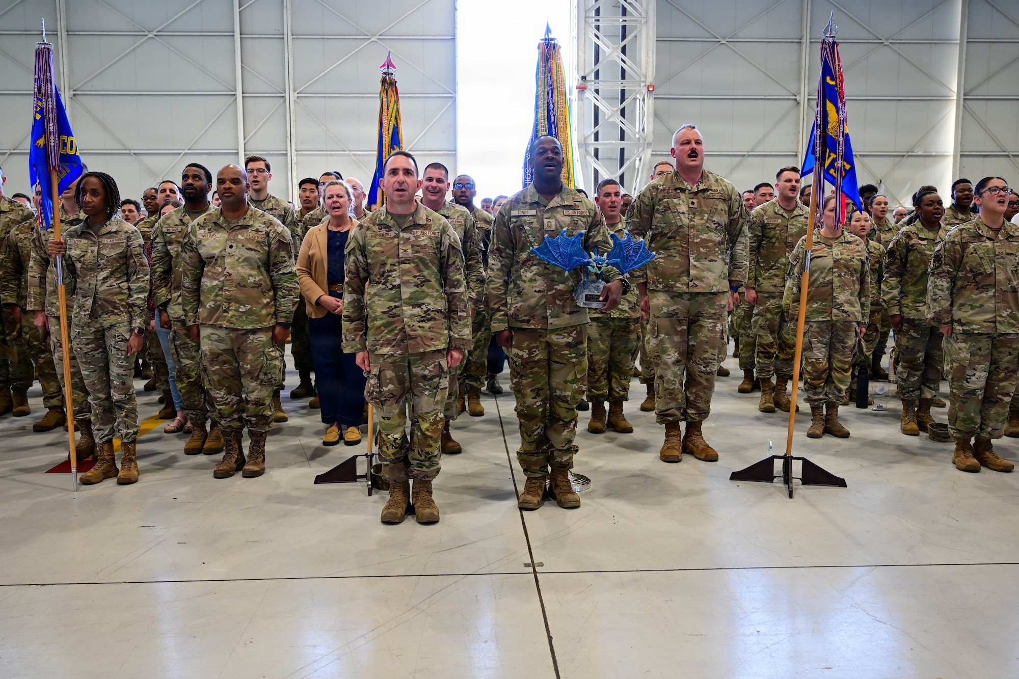 U.S. Air Force Airmen from the 31st Fighter Wing sing the Air Force song to conclude the 1st Quarter Wing Awards ceremony at Aviano Air Base, Italy, April 24, 2026.