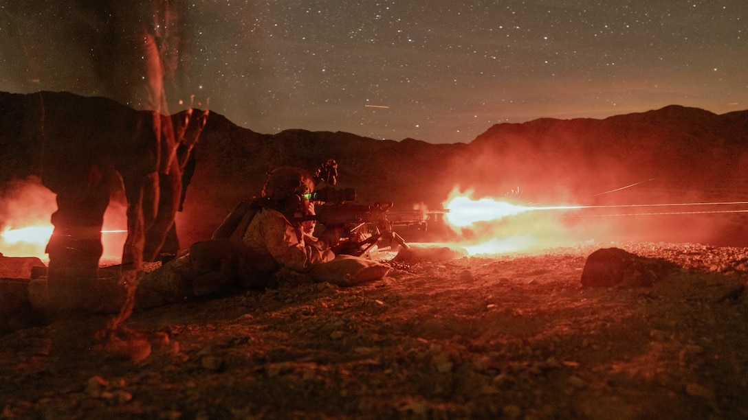 A U.S. Marine with 1st Battalion, 2nd Marine Regiment, 2nd Marine Division, fires an M240B medium machine gun during a live fire platoon attack on range 410 Alpha as part of Service Level Training Exercise 2-26 on Marine Corps Air Ground Combat Center, Twentynine Palms, California, April 3, 2026. Designed to simulate the most realistic complex training environment available, SLTE ensures units are combat-ready and capable of operating as an integrated Marine Air-Ground Task Force. (U.S. Marine Corps photo by Lance Cpl. Dominic Trujillo)