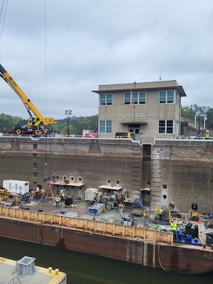 Picture of men working on a lock.
