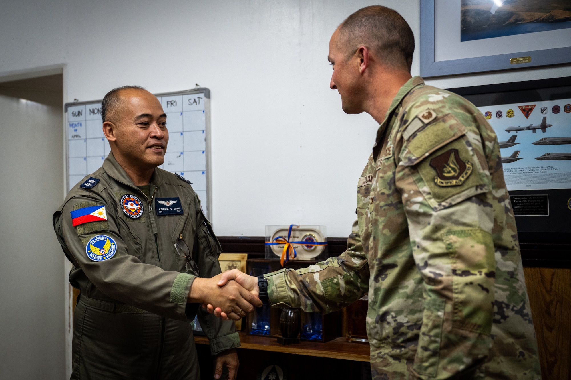 Philippine Air Force Lt. Col. Alexander Ilagan, 600th Air Base Group deputy commander, left, greets Col. Paul Julian, 21st Air Expeditionary Wing deputy commander, right, during Exercise Balikatan 2026 at Clark Air Base, Philippines, April 21, 2026. Leadership from the 21st AEW and the 600th ABG met to strengthen interoperability and explore integration opportunities in support of BK26. (U.S. Air Force photo by Airman 1st Class Adrien Tran)