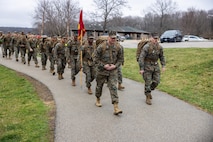 U.S. Marine Corps Col. Aaron C. Lloyd, left, commanding officer of 9th Marine Corps District, leads a formation during a 15-kilometer hike at Rock Cut State Park in Caledonia, Illinois, April 3, 2026. Marines with the district conducted the hike to maintain unit physical fitness and mission readiness. (U.S. Marine Corps photo by Cpl. Maxwell Cook)