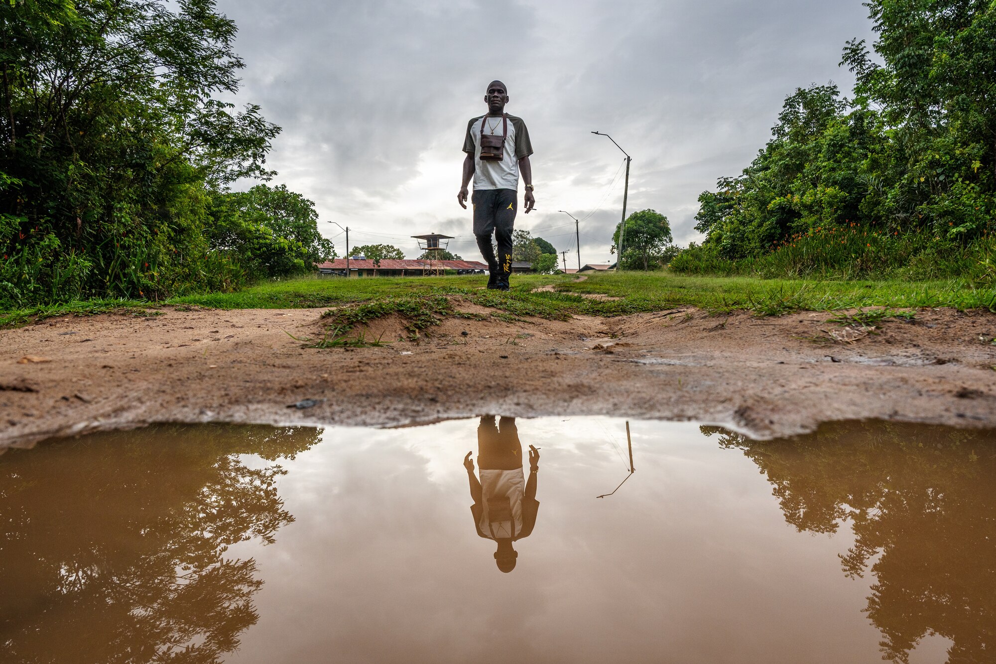 A Surinamese man walks away from the Medische Zending Primary Health Care Center in Brownsweg, Suriname, after receiving care during a Lesser Antilles Medical Assistance Team (LAMAT) 2026 mission, April 15, 2026. The mission is the second LAMAT engagement in Suriname, reinforcing continued partnership through medical collaboration, patient care, and knowledge exchange. (U.S. Air Force photo by Staff Sgt. Joshua Hastings)
