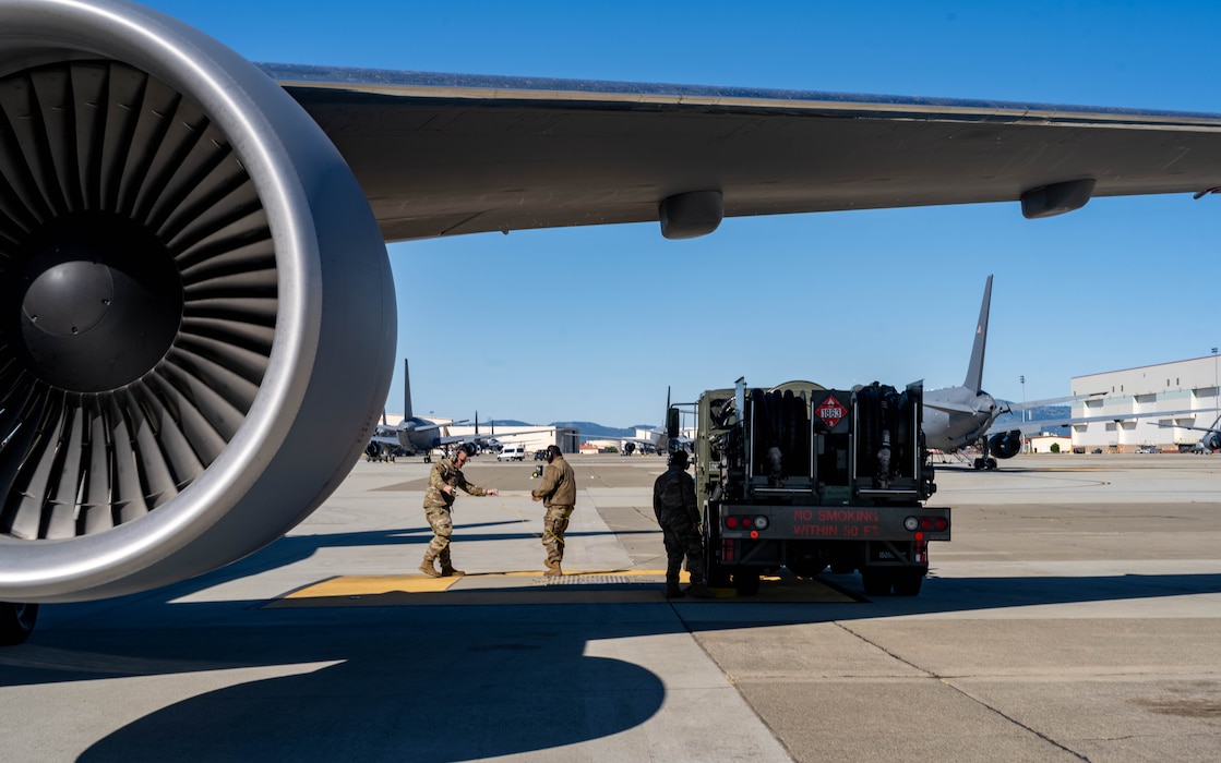 Two U.S. Airmen prepare to fuel a KC-47 Pegasus at Travis Air Force Base.