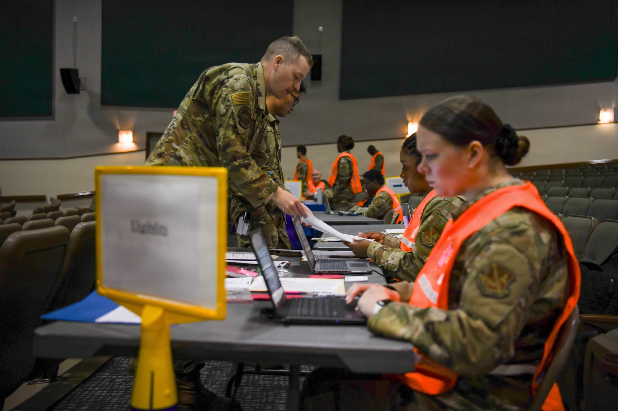 An airmen goes through a process line.