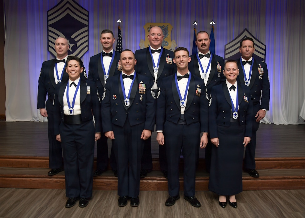 A group of people in military uniform pose for a group photo.