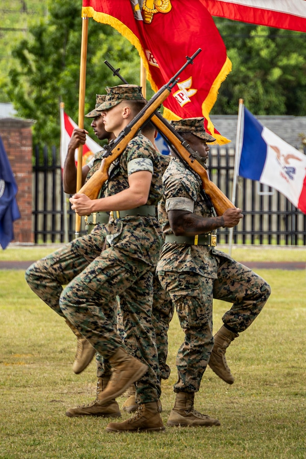 U.S. Marines with the Marine Forces Reserve color guard marches with the colors during a relief and appointment ceremony at Marine Corps Support Facility New Orleans, Apr. 24, 2026. Sgt. Maj. Kabiru Labaran, outgoing sergeant major, relinquished his duties to Sgt. Maj. Roberto Sim, incoming sergeant major, Headquarters Battalion, Marine Forces Reserve, Marine Forces South, who will post as the new Headquarters Battalion sergeant major. (U.S. Marine Corps photo by Lance Cpl. Edward Spears)