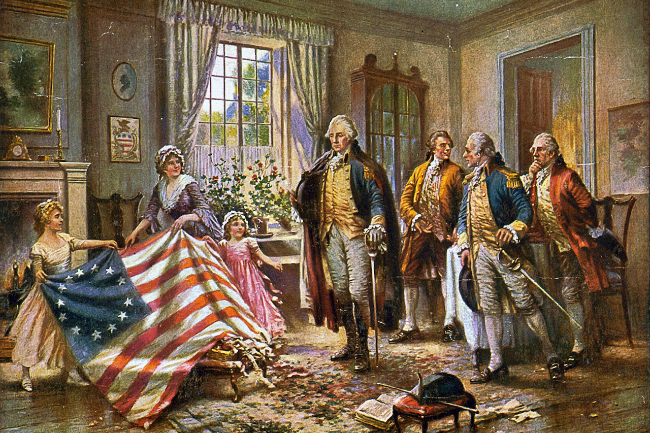 A woman and two young girls hold an early version of the American flag as four men in historical uniform hold swords and look on.