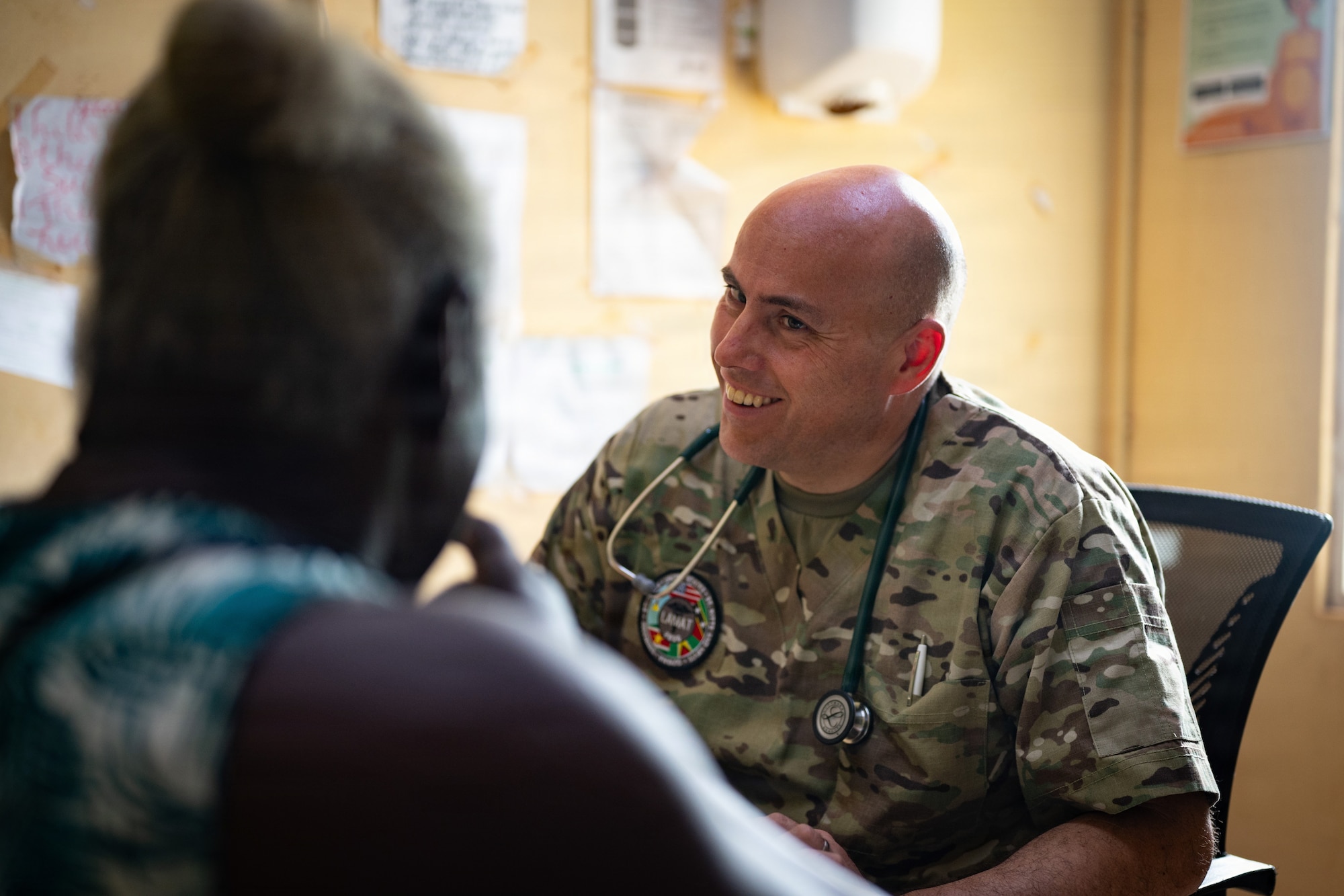 U.S. Air Force Reserve Maj. Kirk Garcia-Rios, 434th Aerospace Medicine Squadron primary care physician, meets with a patient during the Lesser Antilles Medical Assistance Team (LAMAT) 2026 mission at Medische Zending Primary Health Care Center Brownsweg, Suriname, April 16, 2026. Working side by side, LAMAT 2026 strengthens collaboration between U.S. and Surinamese medical teams through shared patient care. (U.S. Air Force photo by Staff Sgt. Madeline Herzog)